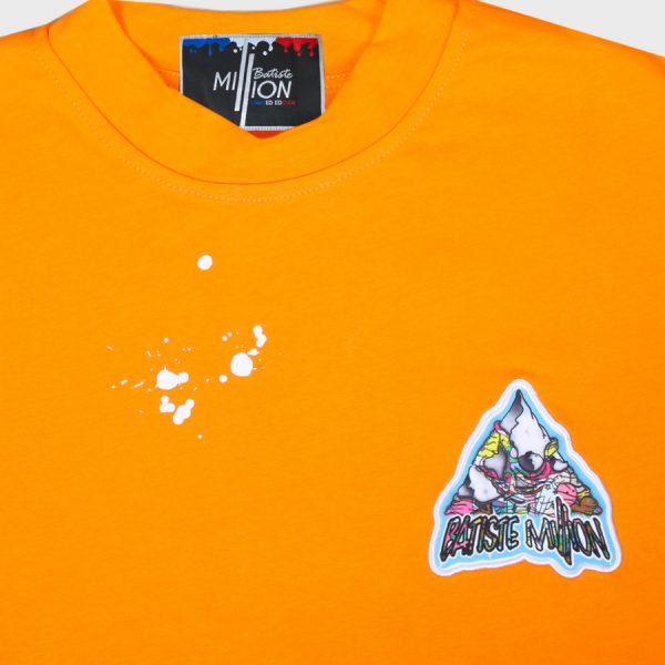 T-shirt orange avec tâches blanches